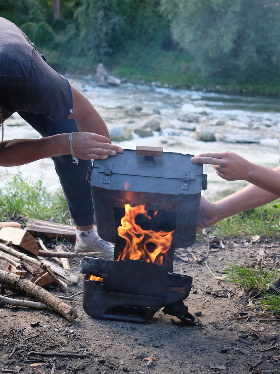pizza oven being assembled onto fire