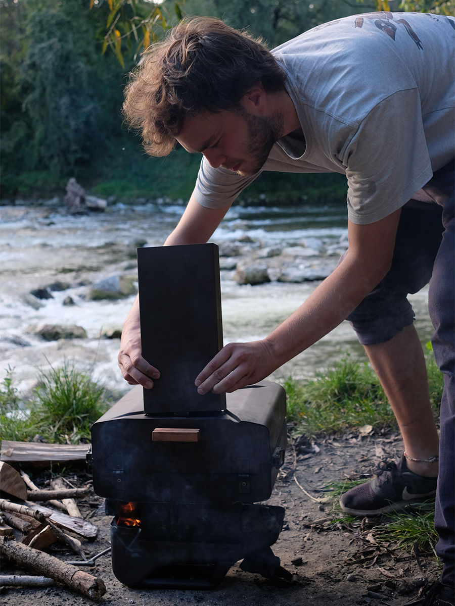 pizza oven being assembled onto fire