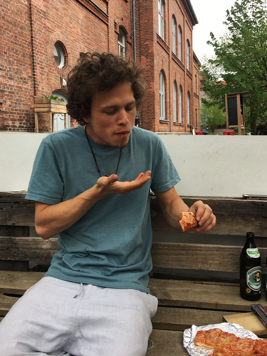 student eating pizza